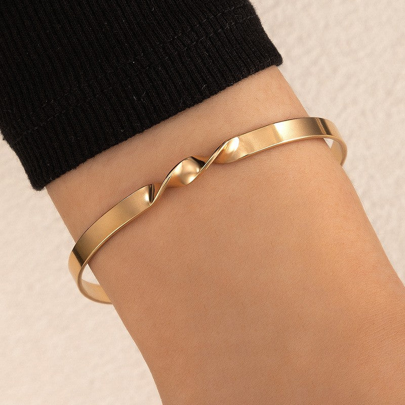UNI-11104- Twist Gold Bangle - Bracelet