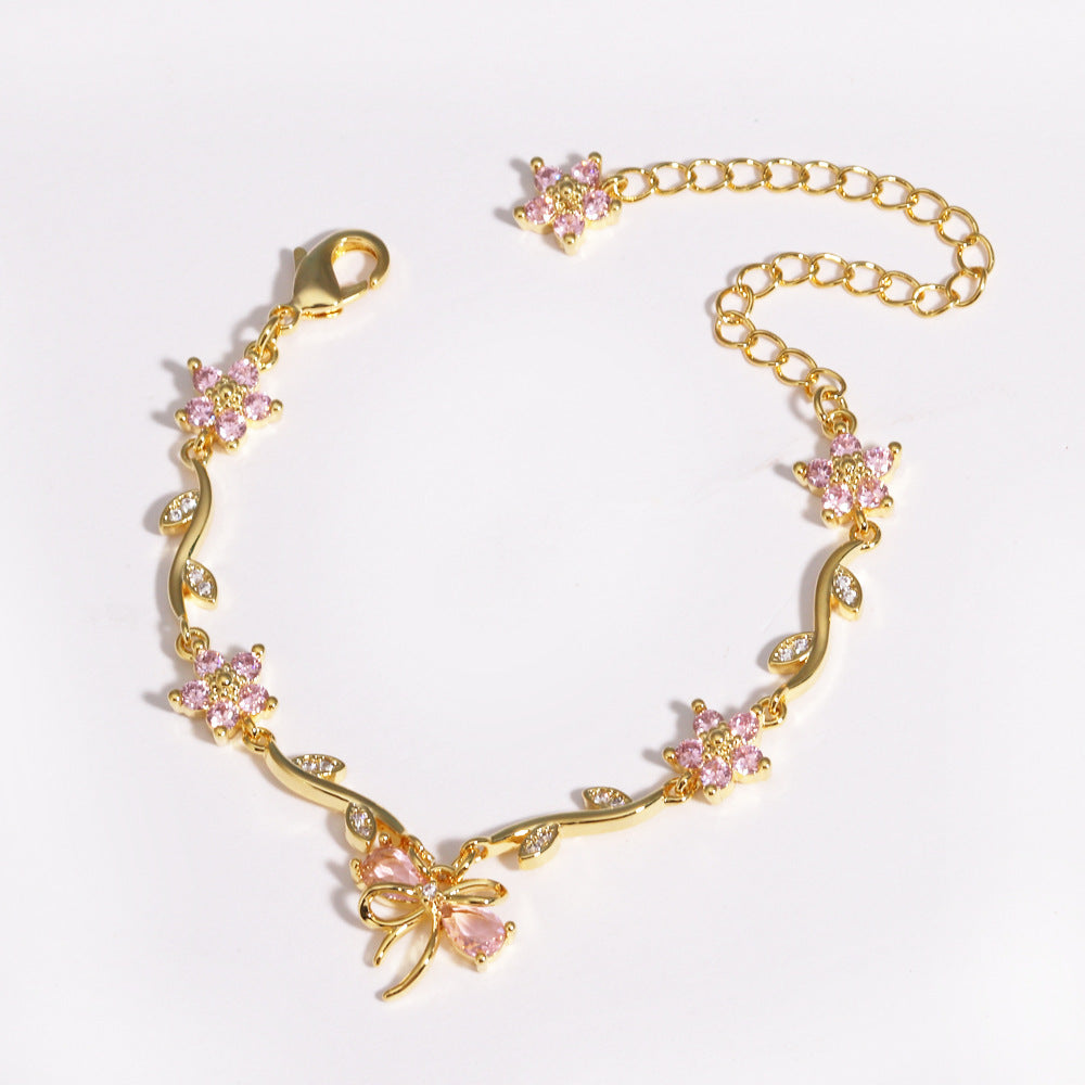 UNI-12210 - Red Diamond Bow & Flowers Gold - Bracelet
