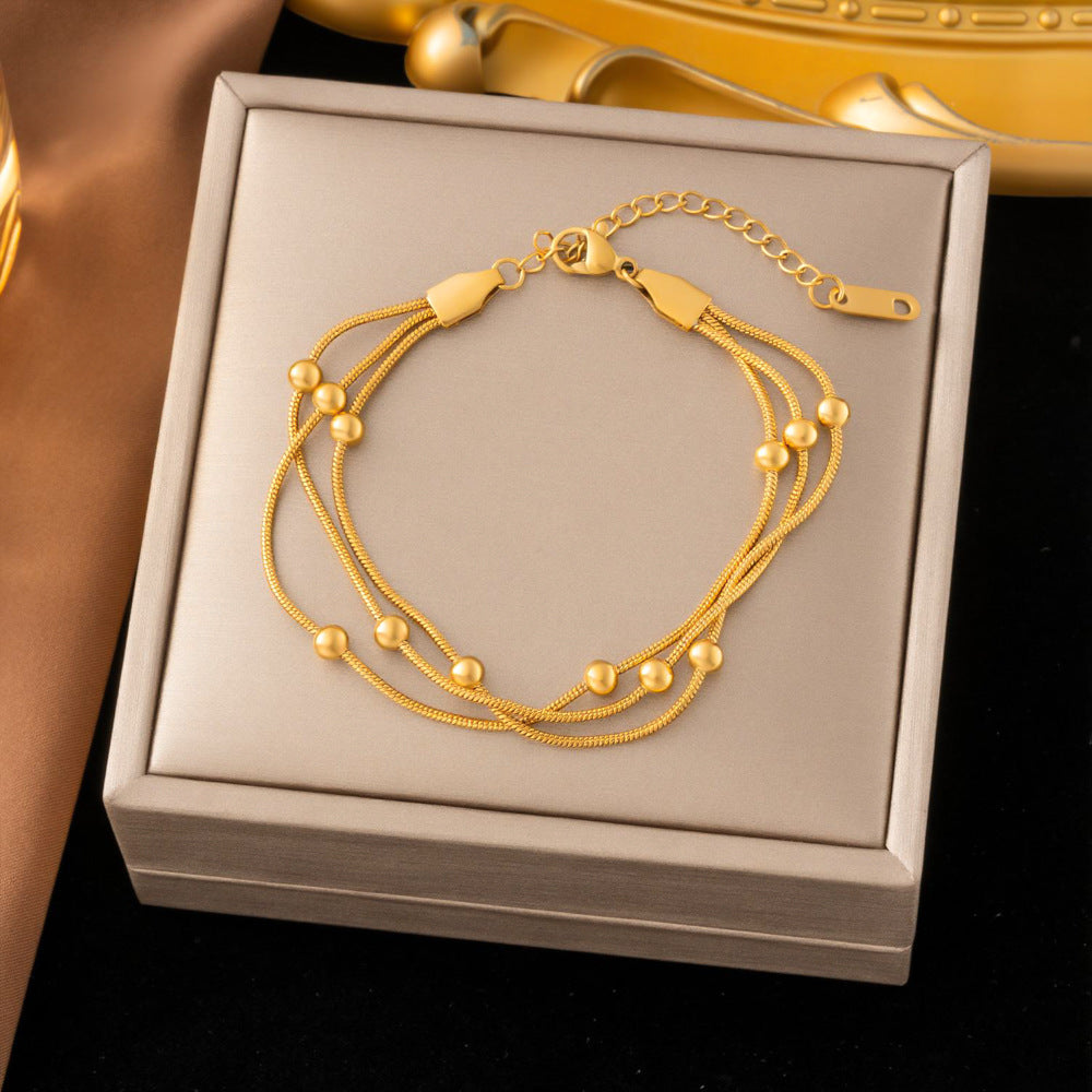SS-12512- 3 Layered Gold Beads - Bracelet