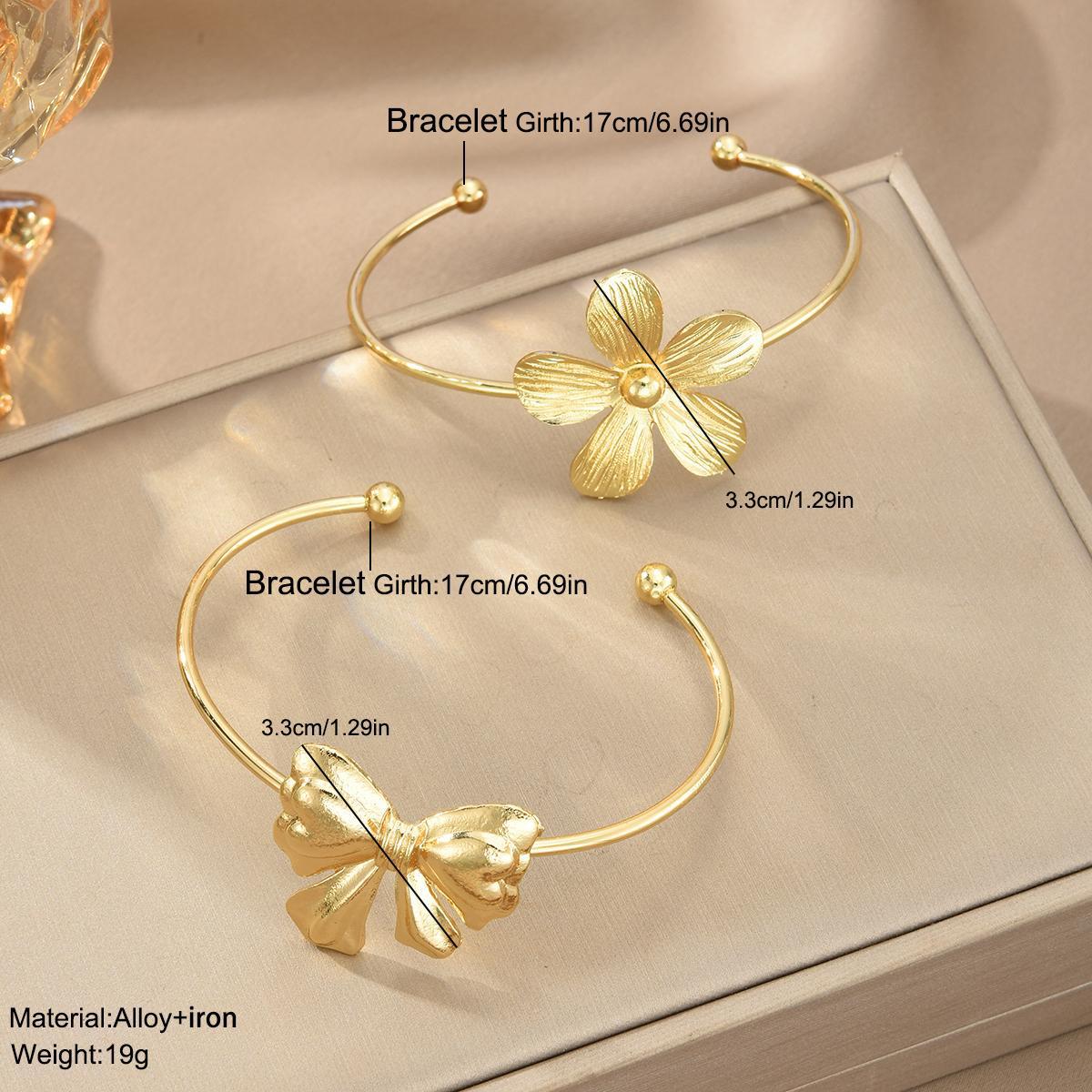 UNI-10643 - Bow & Flower Gold Bangle - Bracelet