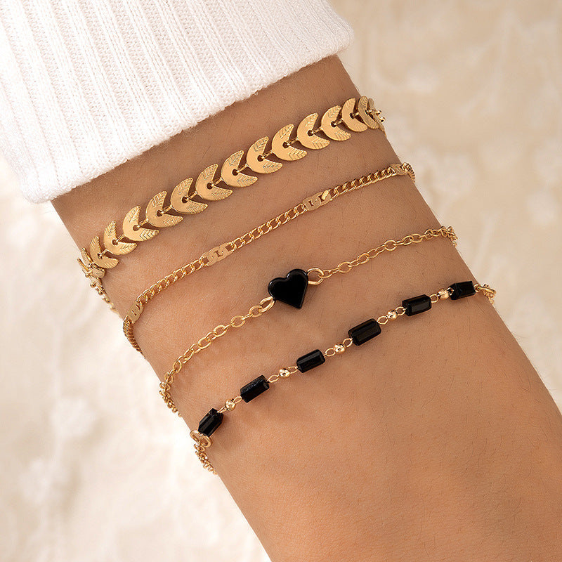 UNI-10154 - Black & Gold Heart - Bracelet Set Of 4