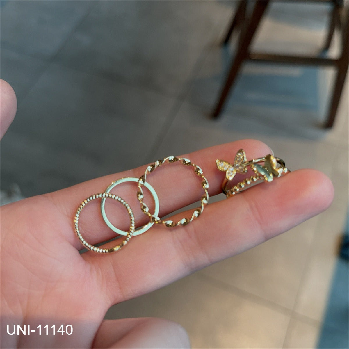 UNI-11140 - Gold Foil Butterfly Ring Set Of 4