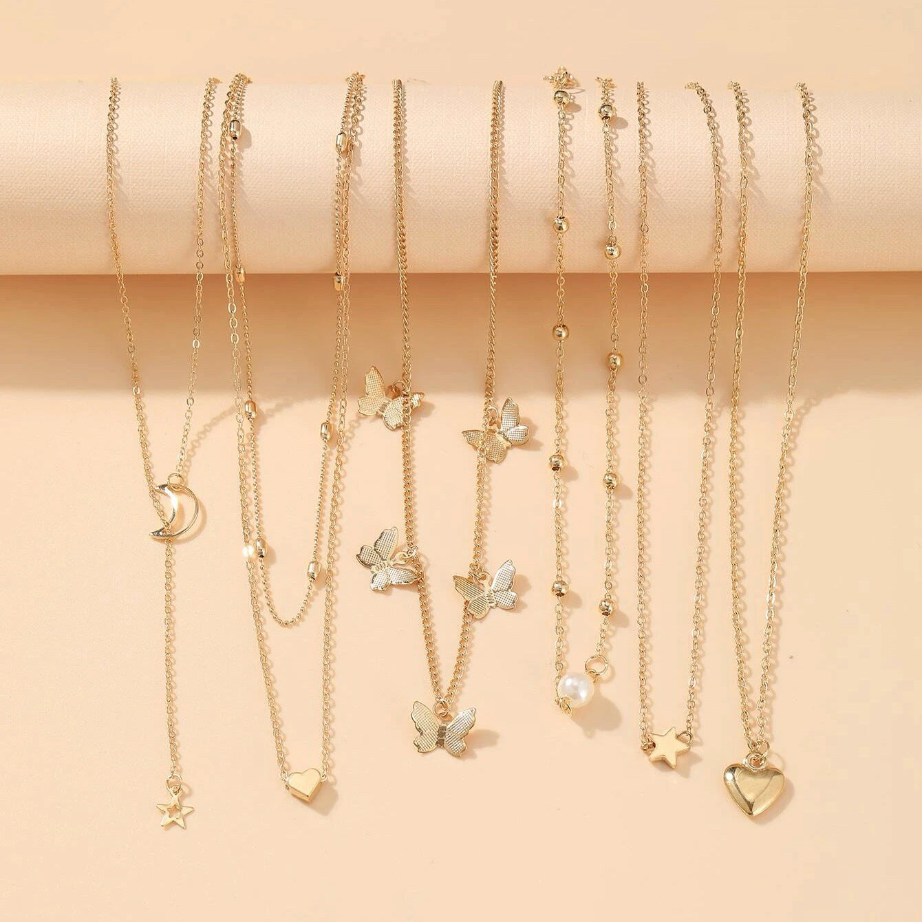 UNI-10652 - Pearl & Butterfly Gold  - Necklace Set Of 6