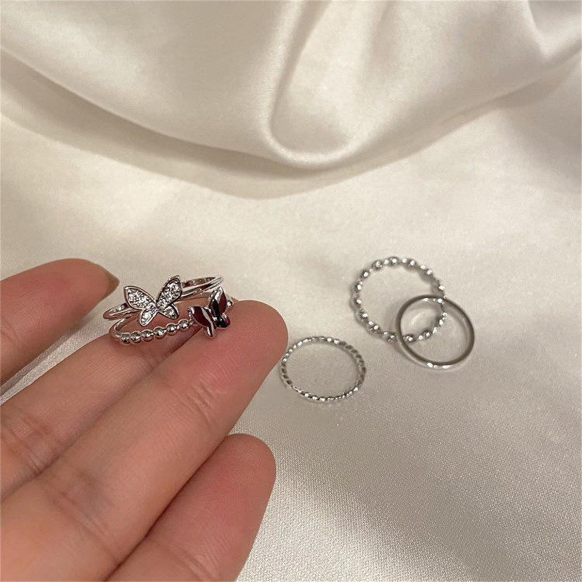 UNI-11139 - Silver Foil Butterfly Ring Set Of 4