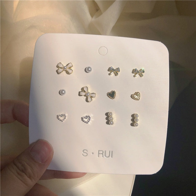 UNI-11907 - Sparkle Bow & Pearl - Ear Studs Set Of 12