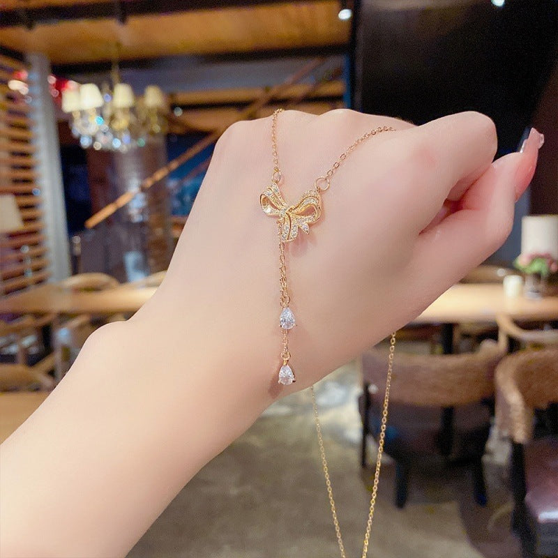 SS-11851 - Pearly Gold Bow - Necklace