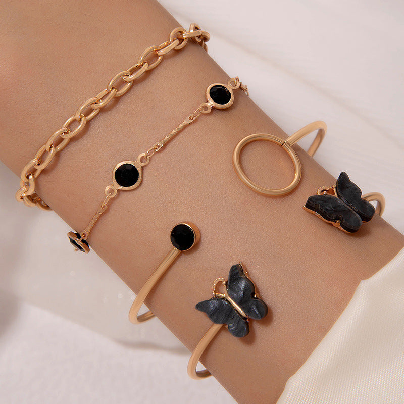 UNI-10154-1 - Black & Gold Butterfly Bangle  - Bracelet Set Of 4