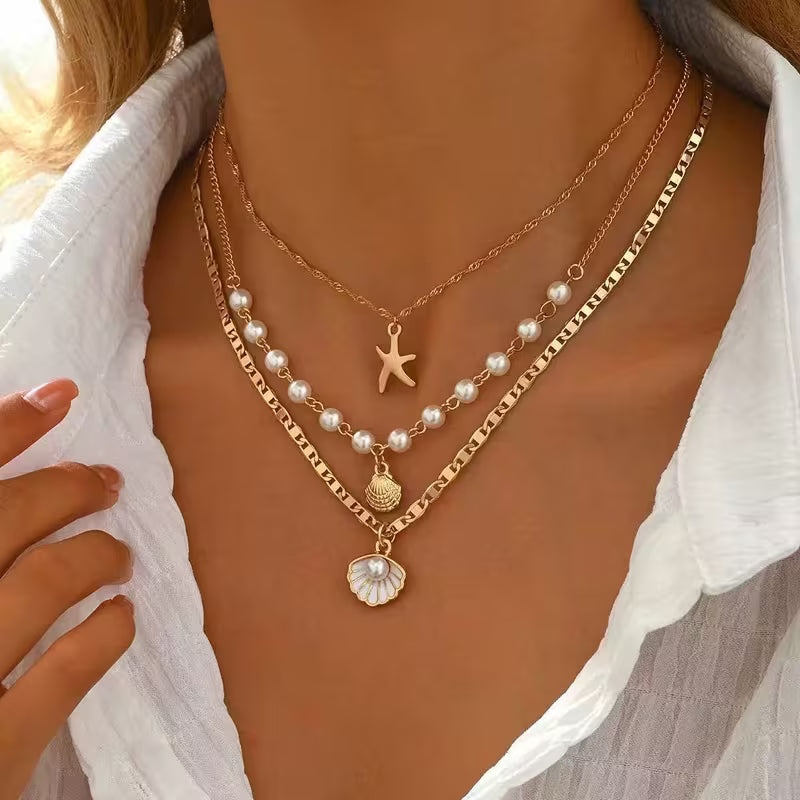 UNI-12828 - Pearl & Sea Charms Gold  - Necklace Set Of 3