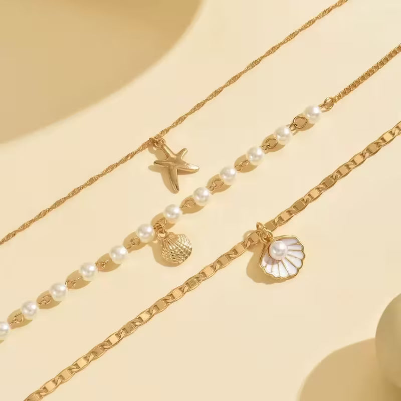 UNI-12828 - Pearl & Sea Charms Gold  - Necklace Set Of 3